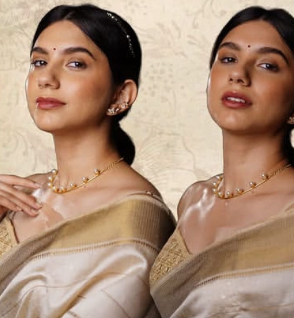 Two models in ivory silk sarees with pearl jewellery and glowing skin, from The Ivory Bloom edit