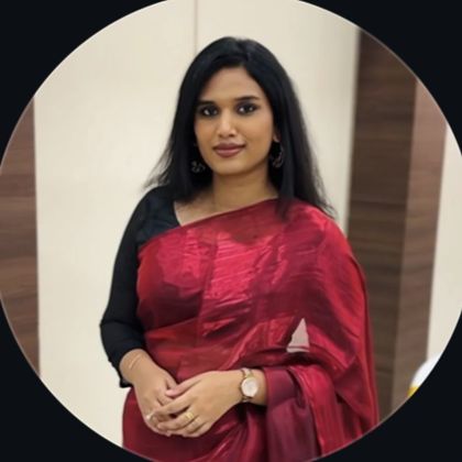 Safira, the makeup artist behind Artistry by Saf, in a red silk saree
